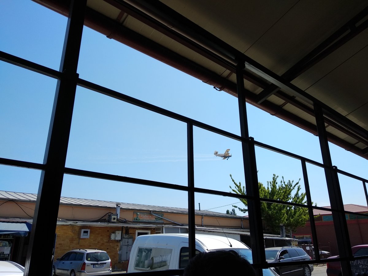 Some really loud propeller plane flying close from the rooftops
