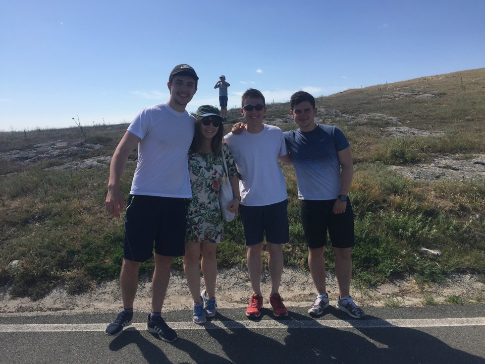 Alina and us during our road trip, along with a photobombing tourist